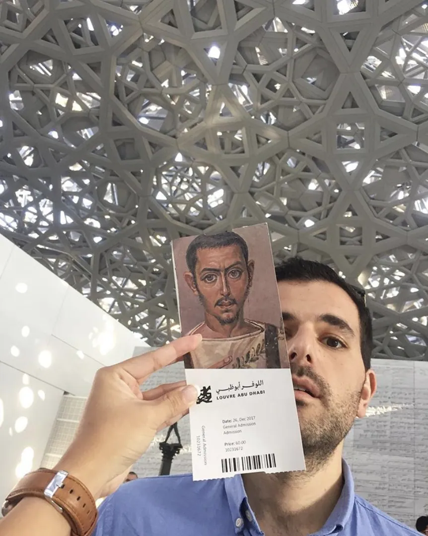 Oliver doing his best portrait impression under the Louvre’s dome.