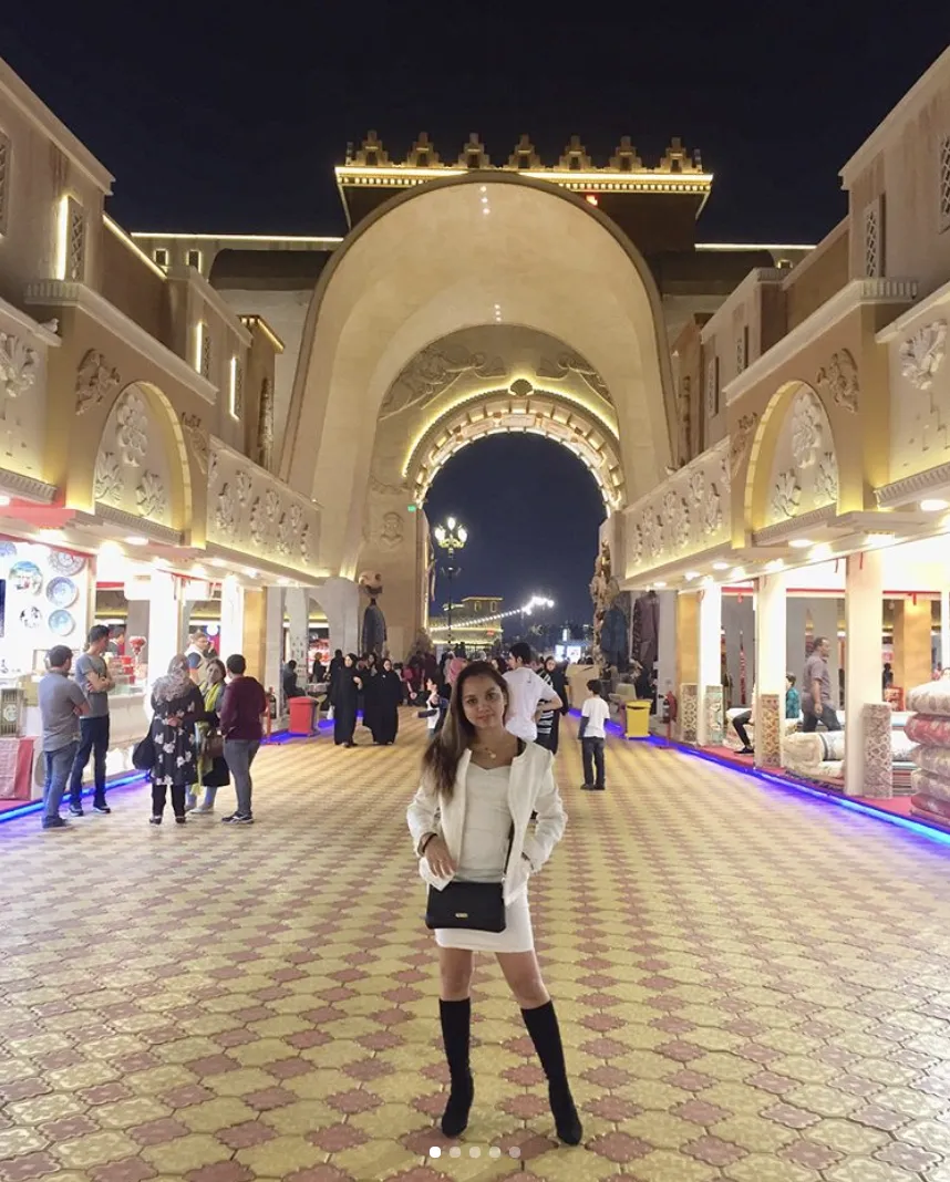 The grand arches of Global Village at night.