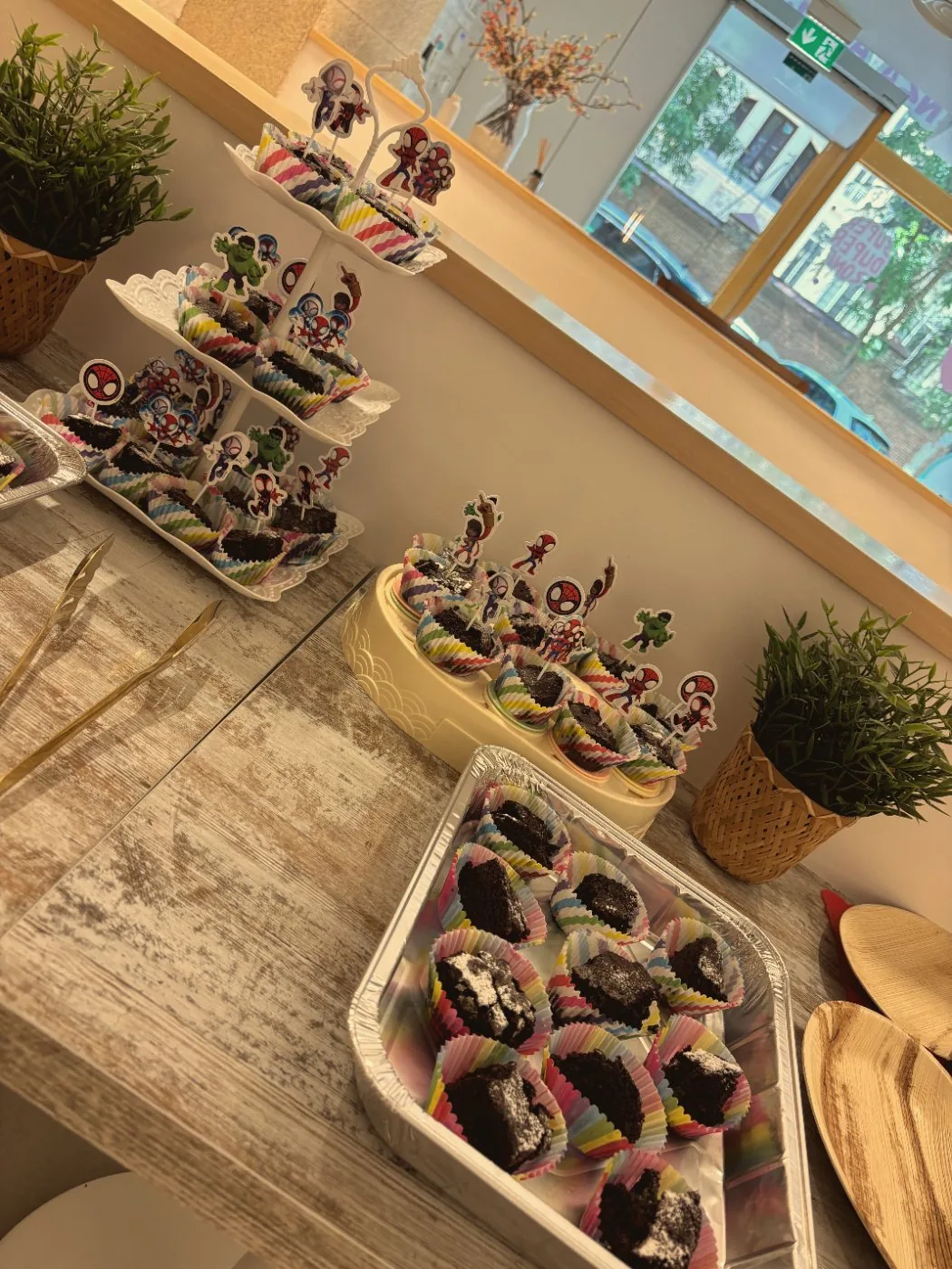 Homemade brownies with Spidey toppers on the dessert table