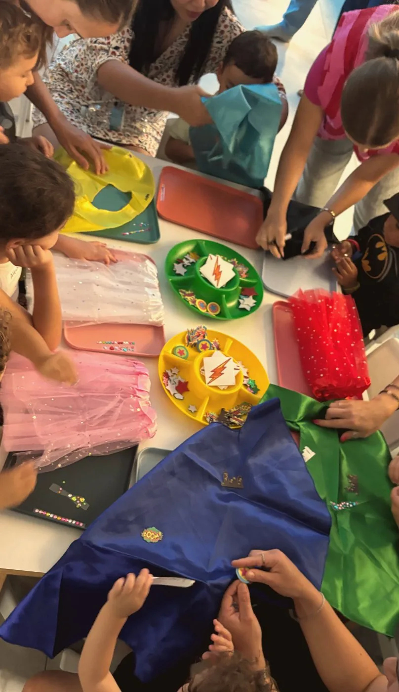 The superhero cape workshop table from above