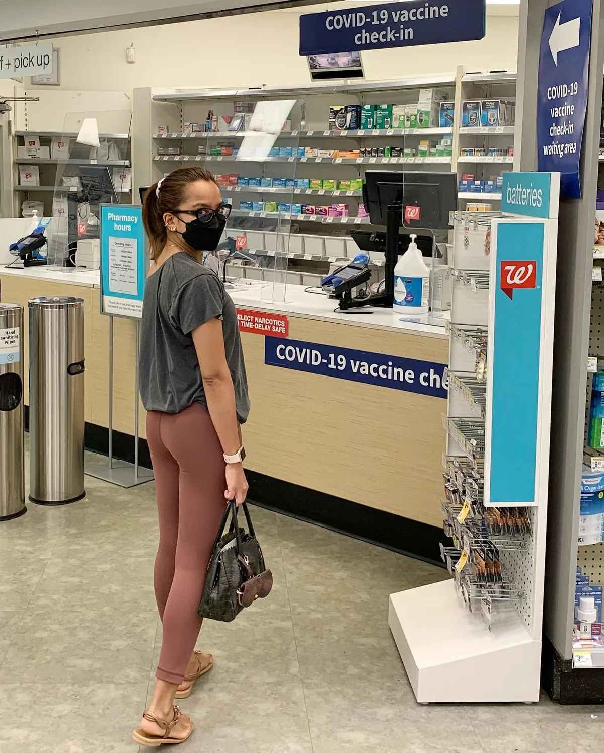 Dee at a pharmacy Covid-19 vaccine check-in
