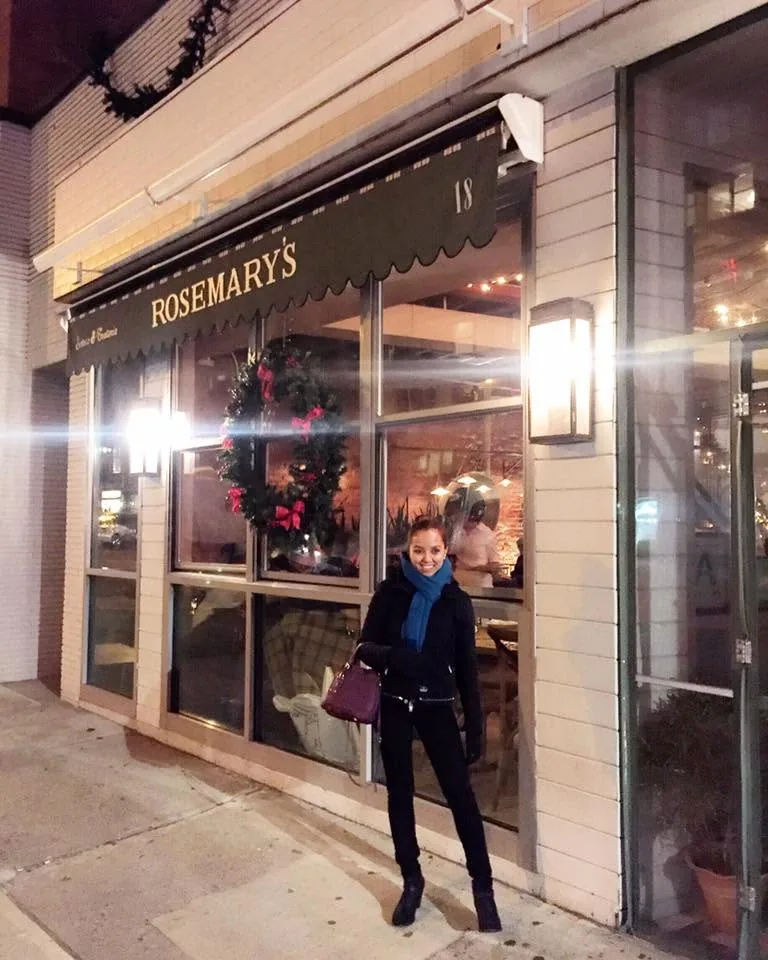 Dee outside Rosemary’s restaurant with a Christmas wreath