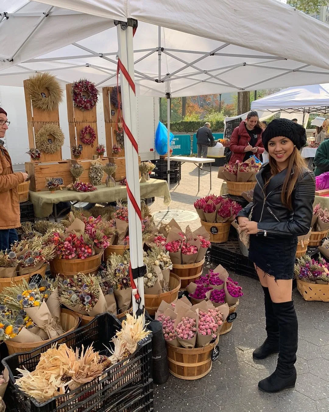Dee at a flower stall at the Union Square market