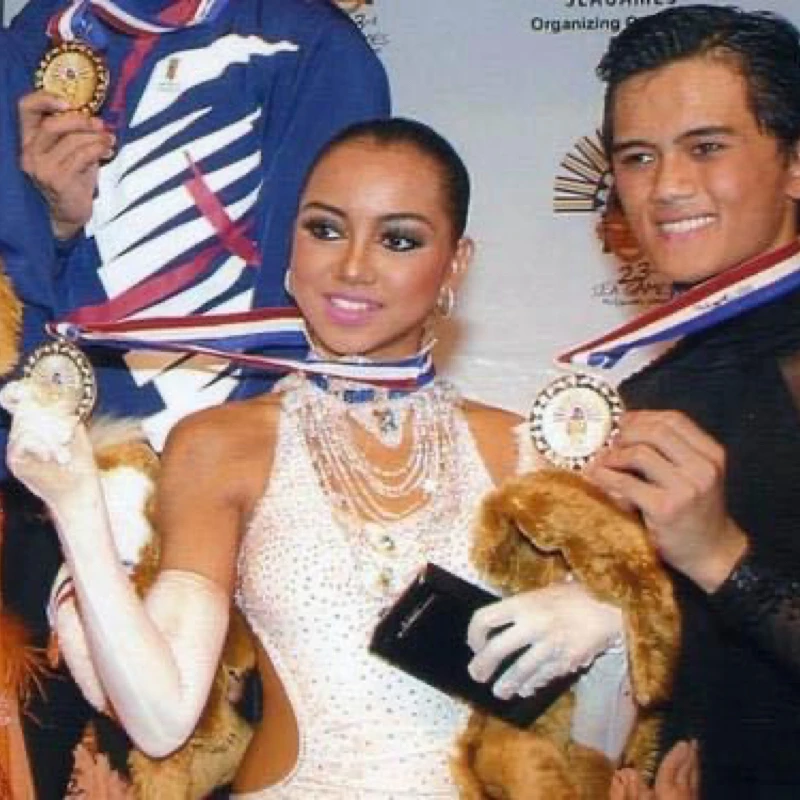Dee and her partner John Erolle holding up their silver medals at the 2005 SEA Games in Cebu