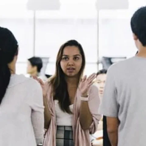 Dee leading a daily stand-up with her product team